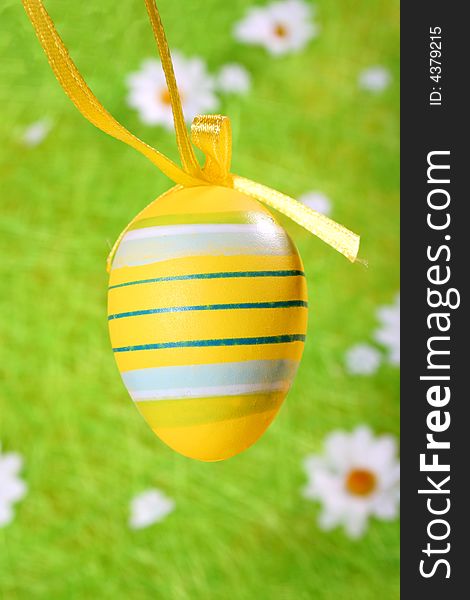 Easter egg on green background