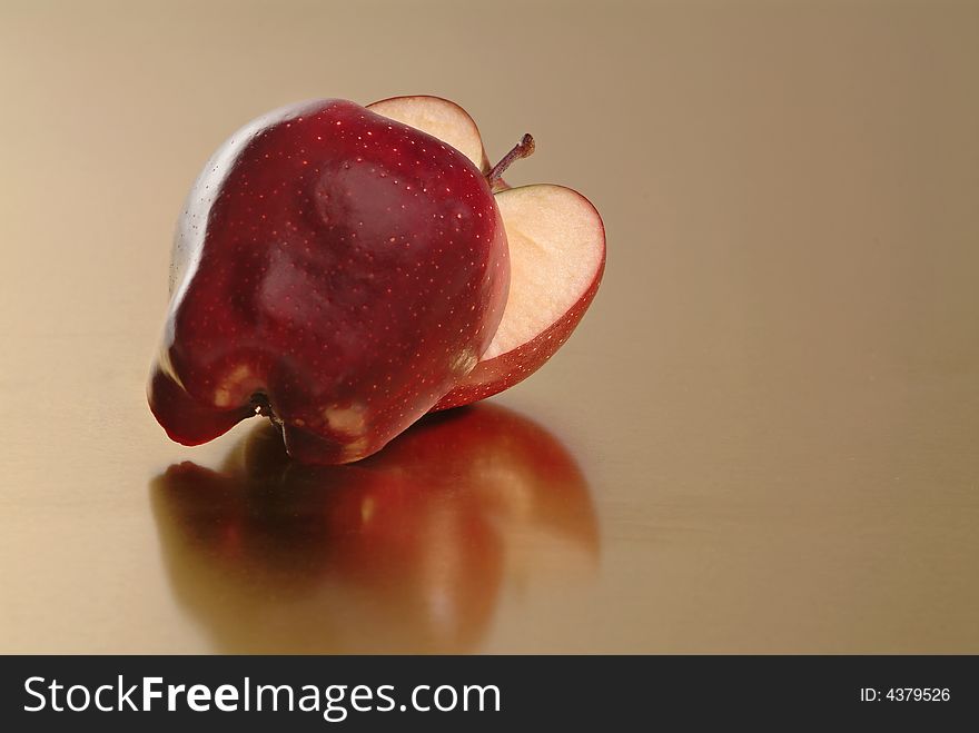 Red apple with golden background