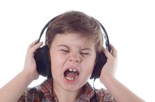 The Little Boy Listens To Music Stock Photo The Little Boy Listens To Music Stock Photo