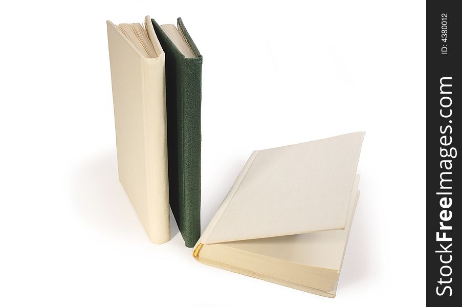 Three hardcover books on white background