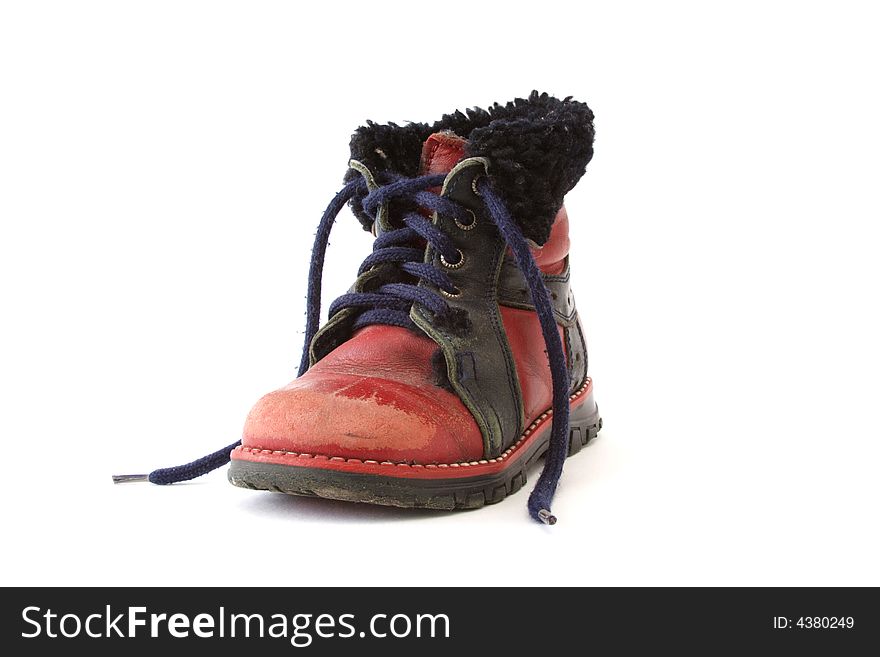 Old baby shoe on white background