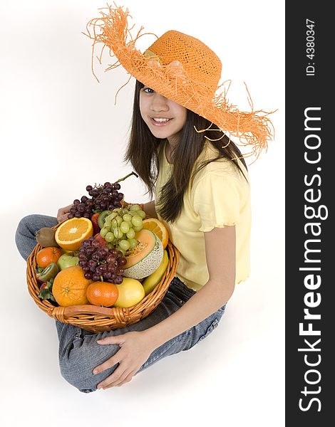 Teenager with fruit basket before white background