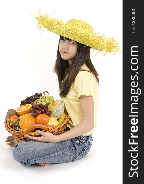 Teenager with fruit basket before white background