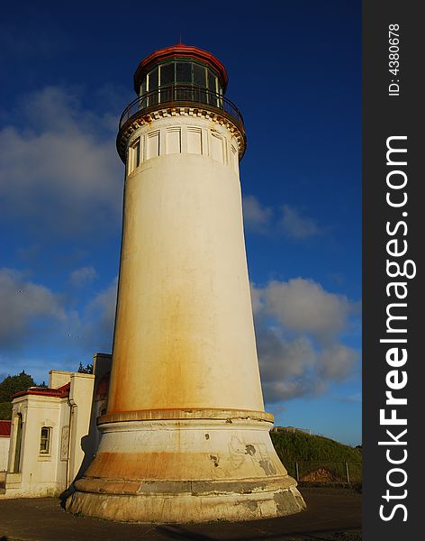 Lighthouse standing tall basking in the sunlight