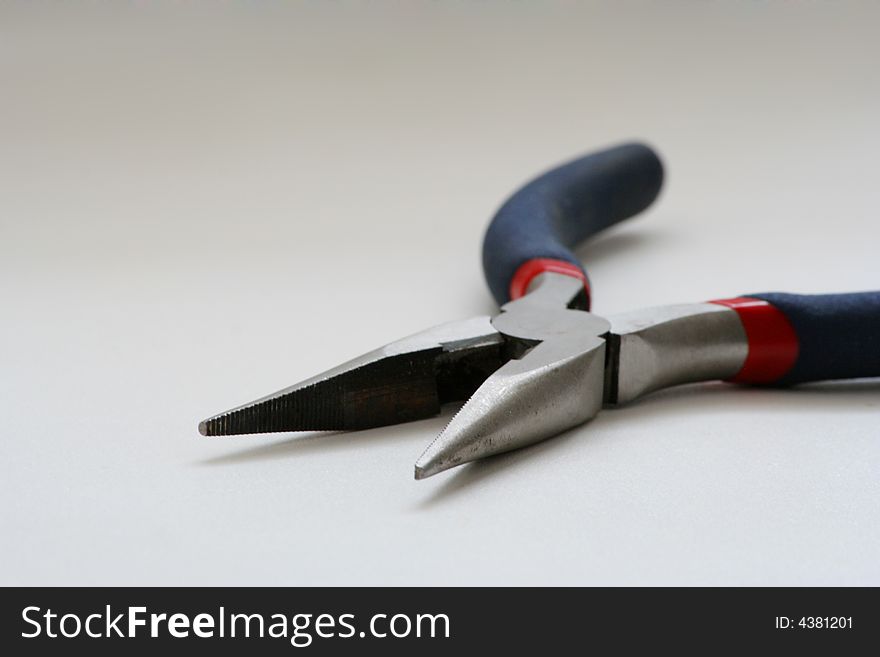 Pliers on a gray background