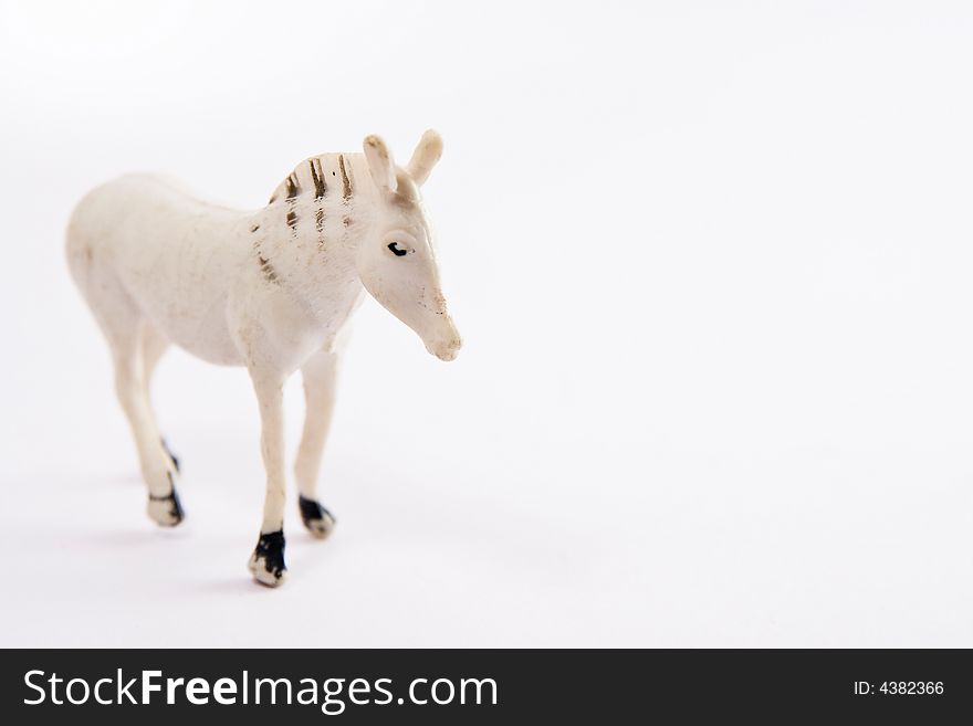 Single horse toy figure macro white background