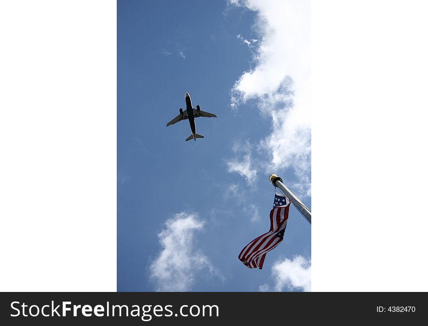 A plane overflew the American flag。. A plane overflew the American flag。