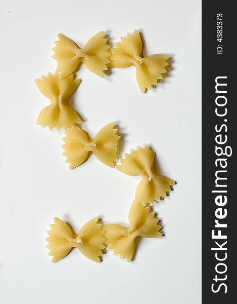 Letter S written with farfalle pasta on white background