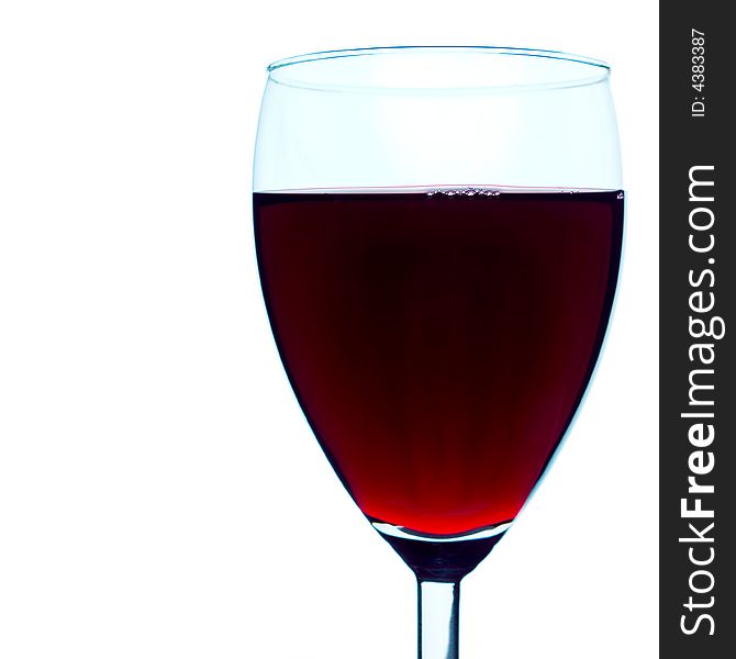 High-contrast studio shot of a back-lit red wine glass. Pure white background, very clean and sharp, a couple of bubbles clearly defined on the surface of the beverage