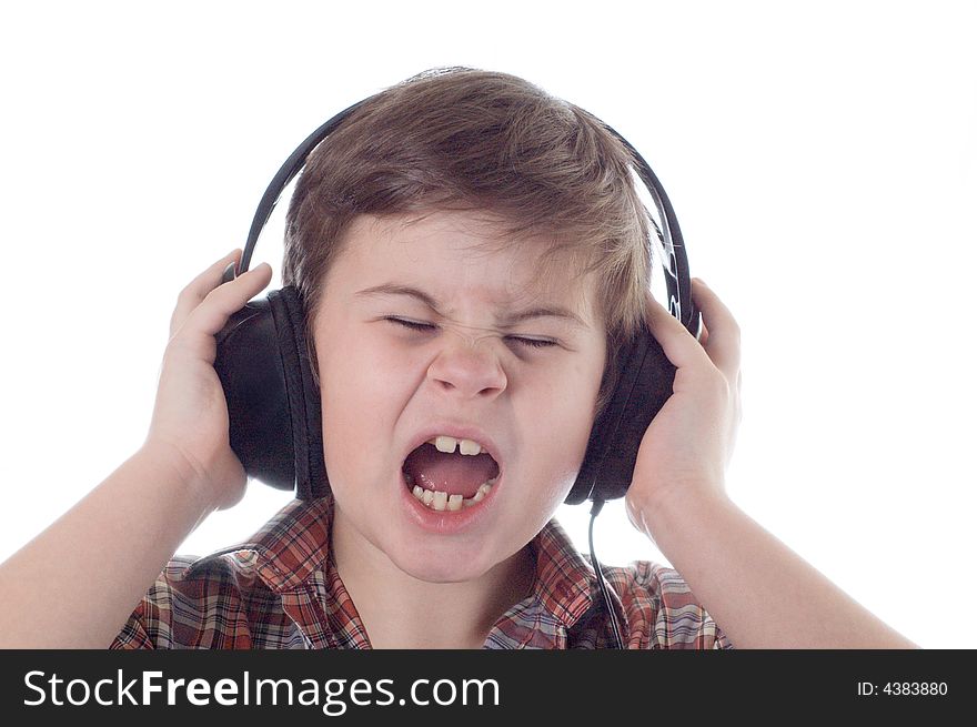 The little boy listens to music and sings a song