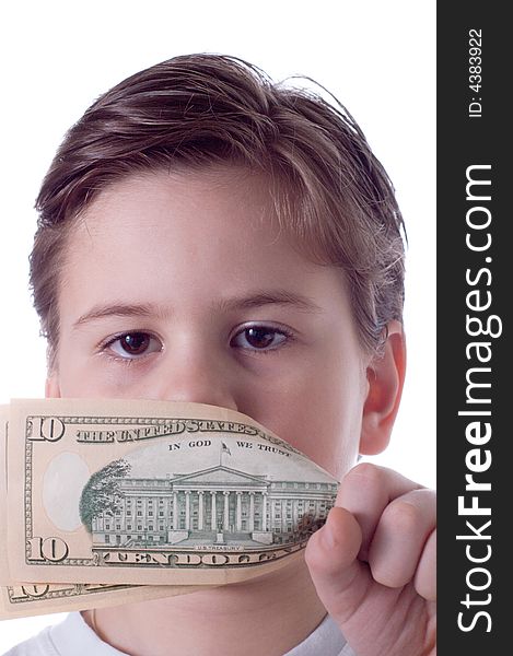The little boy covers a mouth with money. The little boy covers a mouth with money