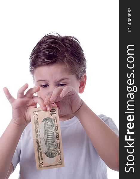 The boy holds money in hands and wishes them to tear. The boy holds money in hands and wishes them to tear