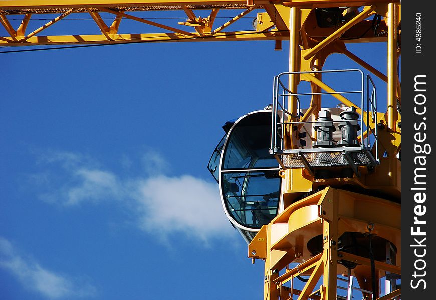 A different angle of a crane against a clear blue sky. A different angle of a crane against a clear blue sky.