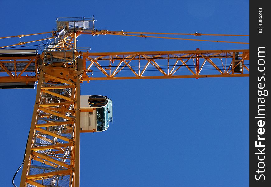 A dynamic angle looking at the bottom side of a crane. A dynamic angle looking at the bottom side of a crane.