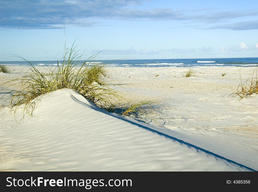 Sand dune with strong diagonal line and beautiful blue sky. Sand dune with strong diagonal line and beautiful blue sky