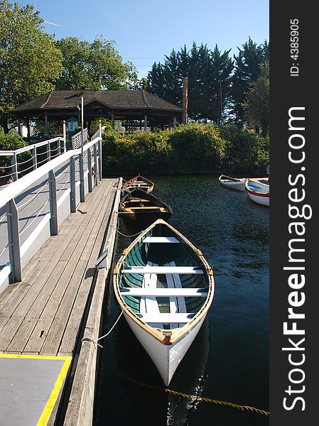 Canoes tied up along a dock and walkway