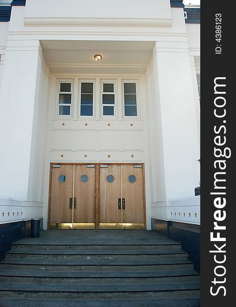 Formal building with wooden doors and golden stars