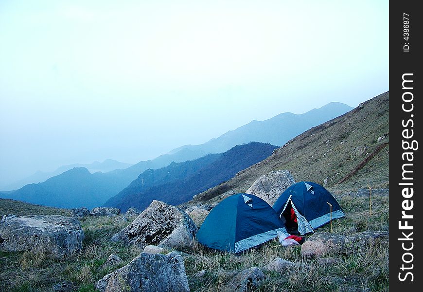Two tents on the mountaintop about 2600m, in the dawn. Two tents on the mountaintop about 2600m, in the dawn