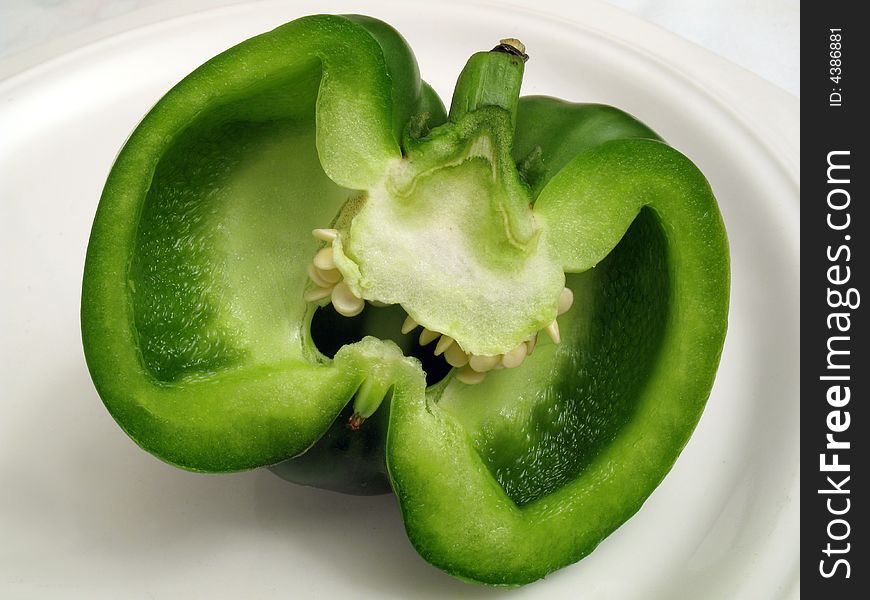 Photo of green pepper cut in half. Photo of green pepper cut in half.