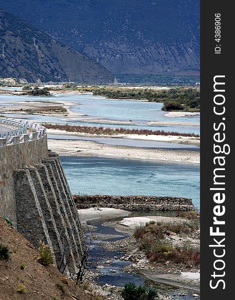 Roadbed like a castel by the riverside, water architecture，dam，valley