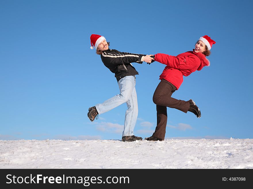 Couple Dance On  Snow Hill In Santa Claus Hats 2