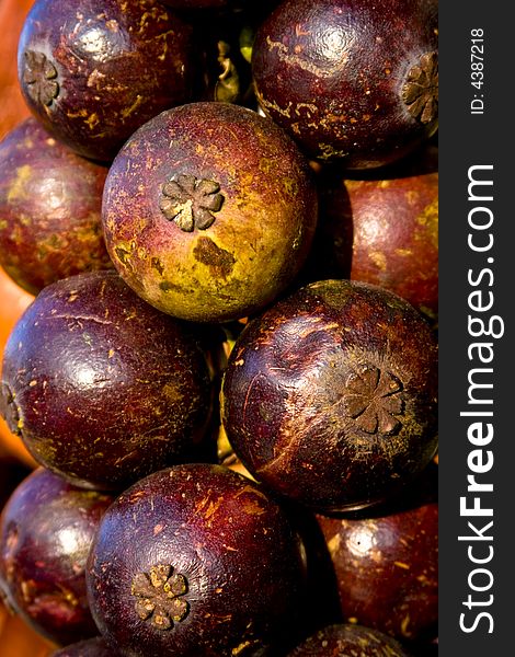 A pile of fresh purple Mangosteen. A pile of fresh purple Mangosteen
