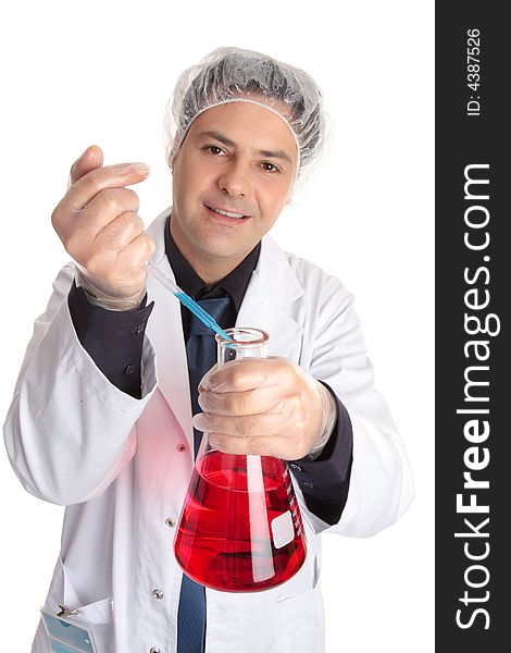 A smiling laboratory research worker adding a measured sample to a flask of solution. A smiling laboratory research worker adding a measured sample to a flask of solution.