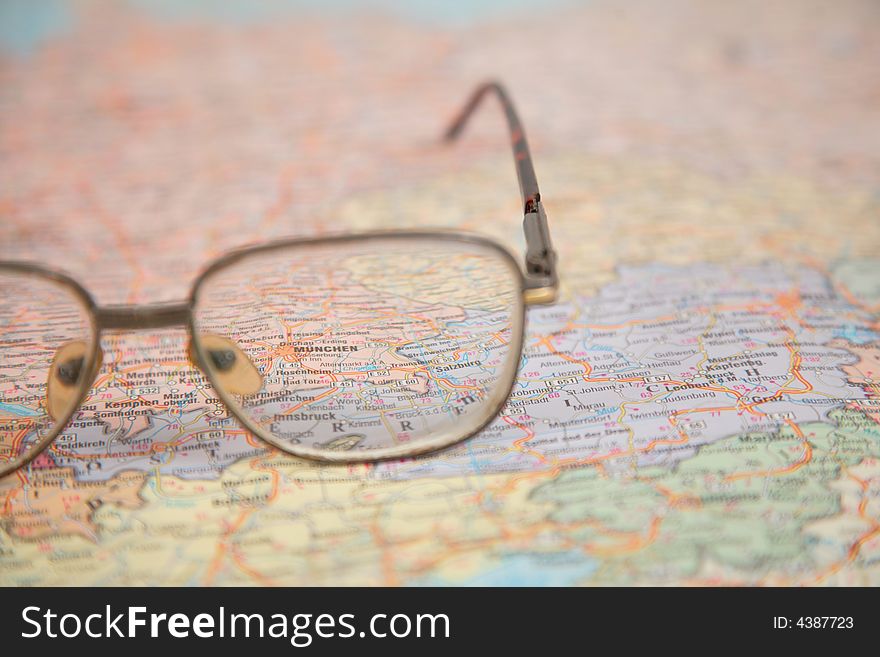 Close-up of glasses on map of europe