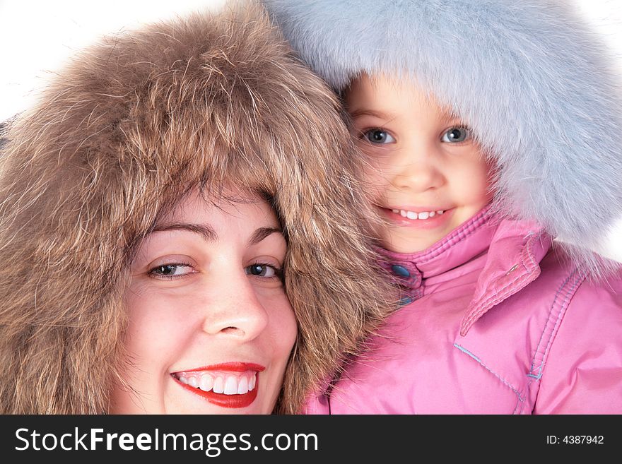 Mother with child in furry hats