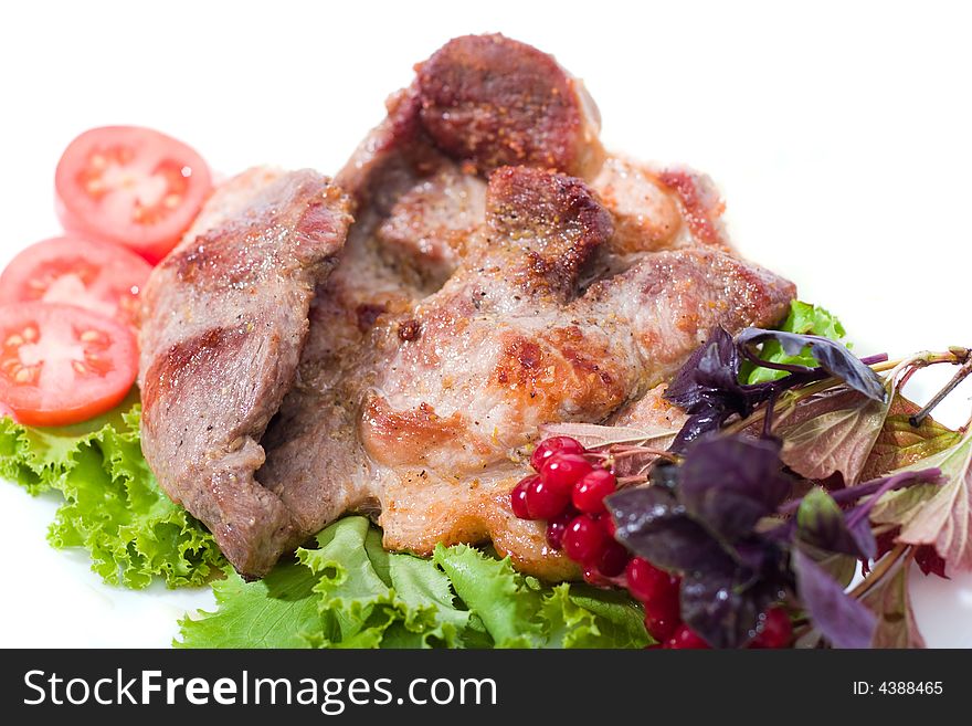 Appetizing pieces of roasted meat on the plate