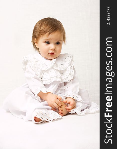 Cute one year old girl in white dress. Cute one year old girl in white dress