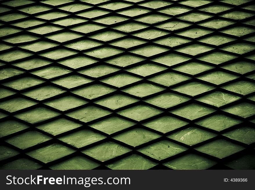 Green pattern created with a black net. Green pattern created with a black net