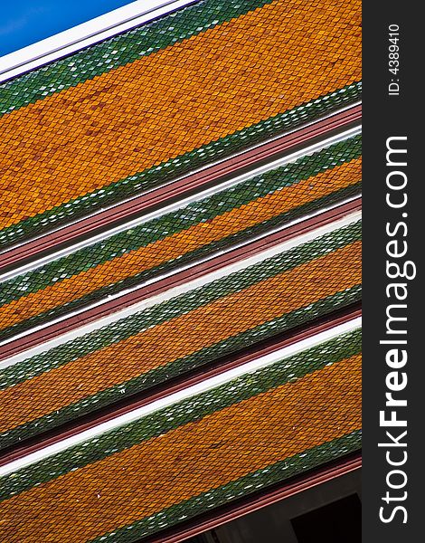 Temple pagoda roof against a blue sky