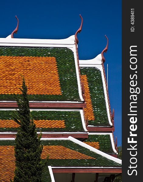 Temple pagoda roof against a blue sky