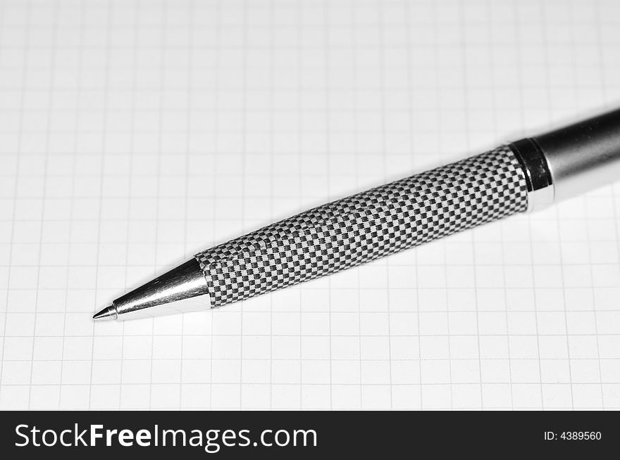 Chess pen laying on paper