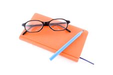 Red Book, Black Glasses And Marker Royalty Free Stock Photography Red Book, Black Glasses And Marker Royalty Free Stock Photography