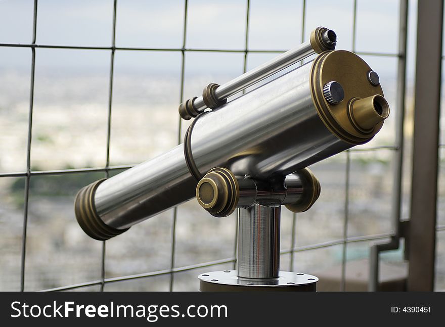 View of monocular telescope at eiffel tower, paris, france