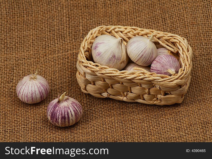 Garlic in the small basket. Garlic in the small basket