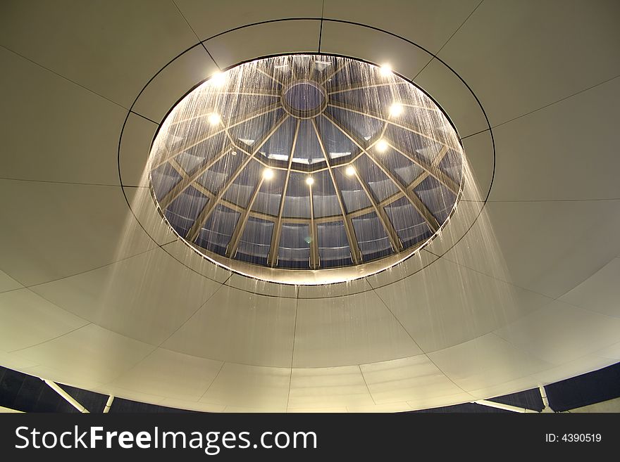 Circular waterfall ceiling at madrid airport, spain