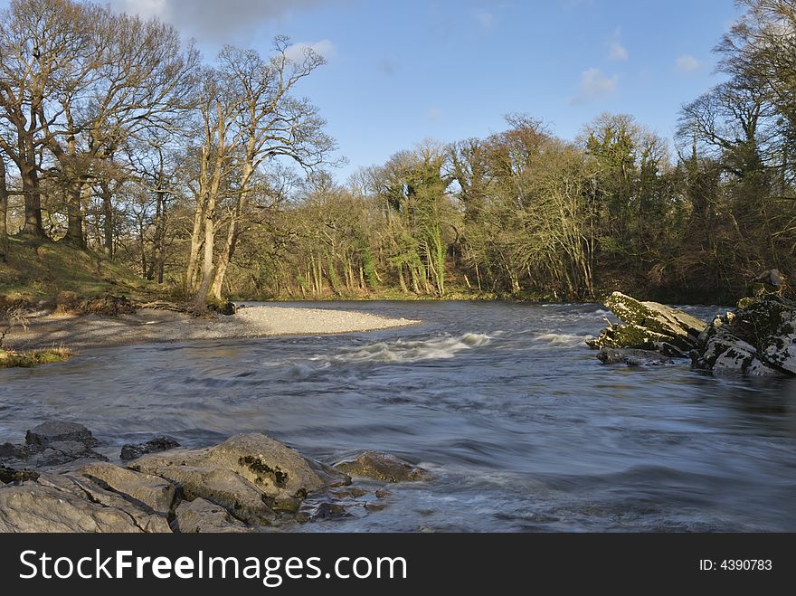 Small rapids on the a bend of the river Lune at Kirkby Lonsdale, Cumbria, UK