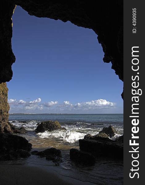 Natural hole in rock at the atlantic ocean in Portugal. Natural hole in rock at the atlantic ocean in Portugal