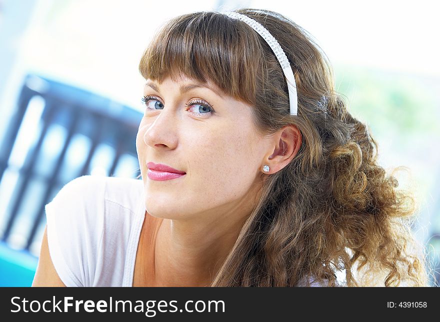 High-key portrait of young blue eyed woman on color back. High-key portrait of young blue eyed woman on color back