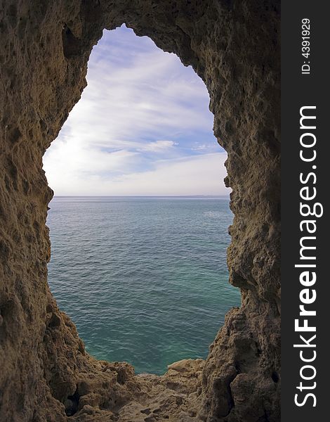 Natural hole in a rock  near Carvoeiro in Portugal