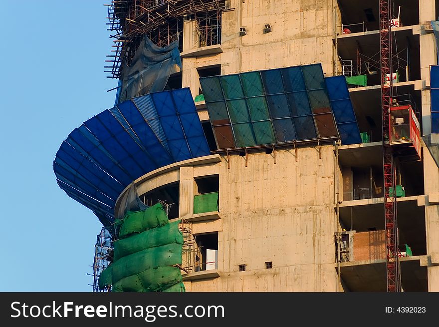 A construction yard where they are building a skyscraper