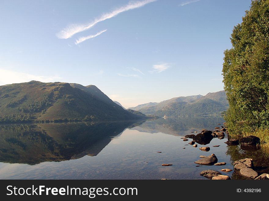 Reflection on Ullswater in the Lake District, Cumbria (England). Reflection on Ullswater in the Lake District, Cumbria (England)