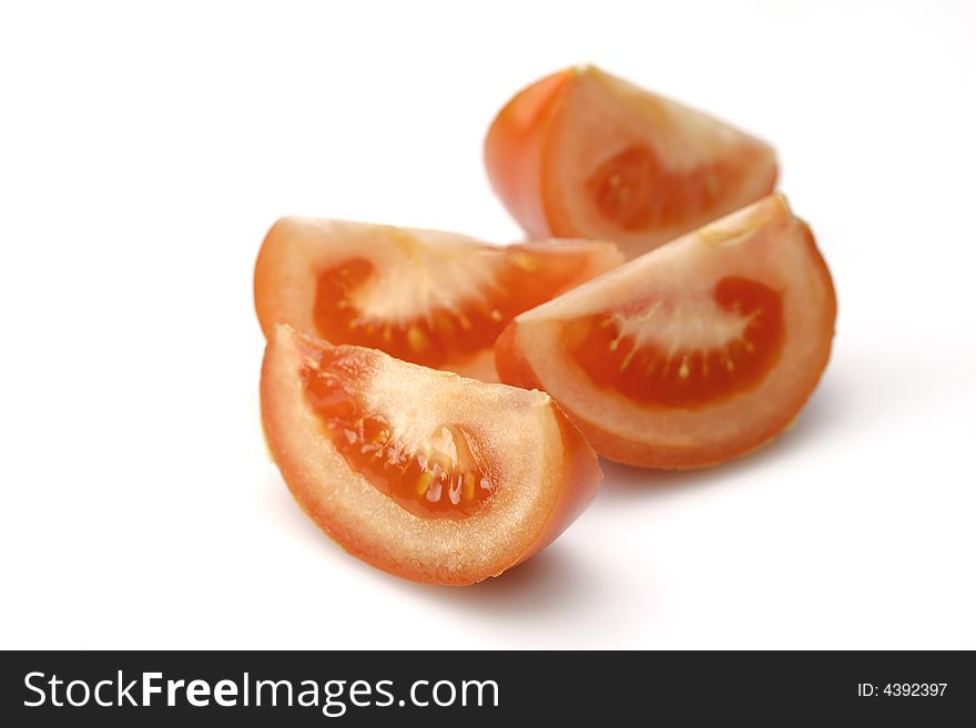 Pieces Of Tomatoes On White