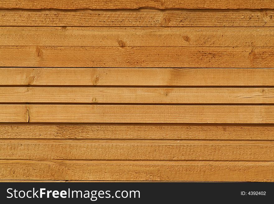 A photo of wooden wall of some suburban house or a shed.