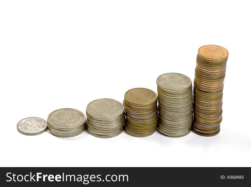 Raising stack of coins. Concept of  a growing chart. Isolated on white. Raising stack of coins. Concept of  a growing chart. Isolated on white