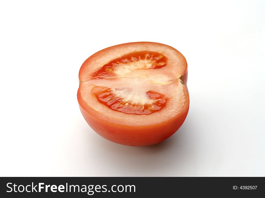 Half Of Tomato On White