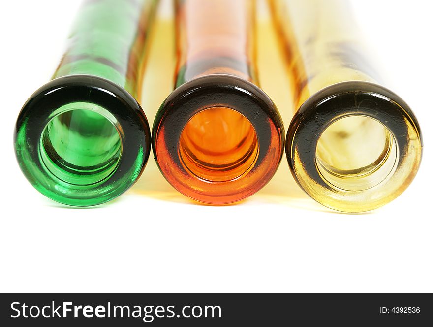 Colorful glass bottles on white. Colorful glass bottles on white